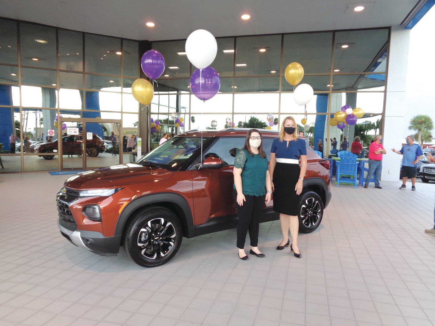 OKEECHOBEE — On Oct. 16, Florida Teacher of the Year Krista Stanley (left) was presented with a free two-year lease on a 2021 Chevrolet Trailblazer by Christa Luna of Gilbert Chevrolet.